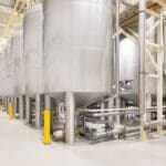 Article image of: 28 rvs chocoladetanks voor duurzame Belcolade chocoladeproductie